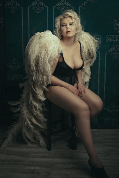 Angel wings boudoir portrait in black lingerie
